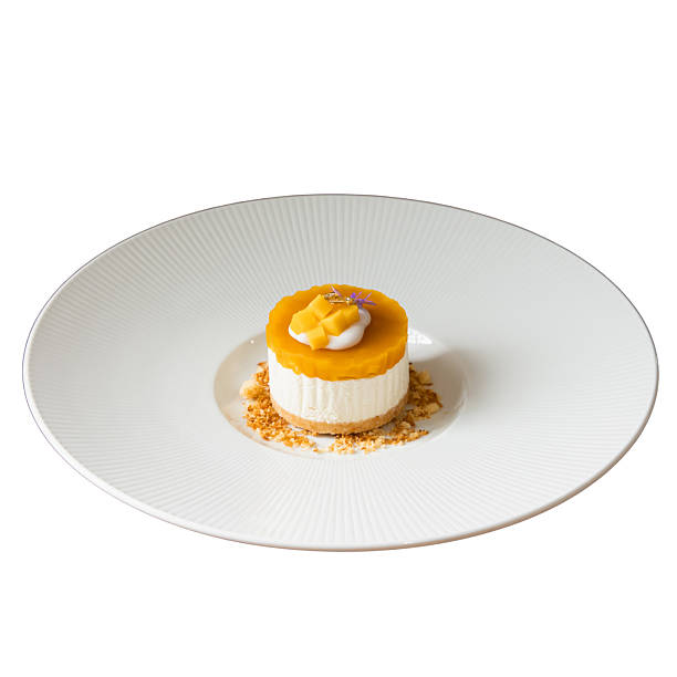 Elegant mango mousse gourmet dessert photography in a culinary setting