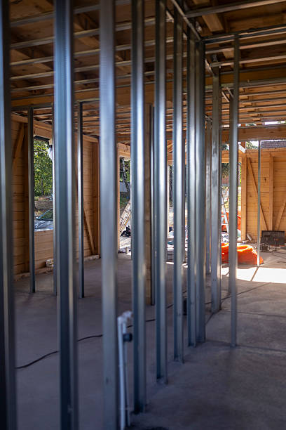 istock Residential House Under Construction Featuring Metal Framing and Wooden Structure 2236231996