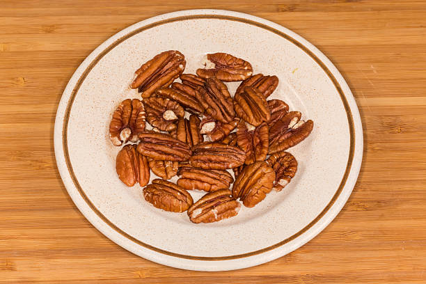 Dry pecan nuts on sacks backgrund.