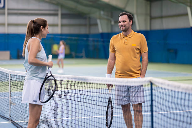 istock Tennis Coaching Discussion on Indoor Court 2236233163