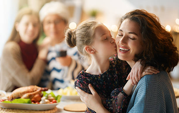 istock Family celebrating Thanksgiving Day 2236235204