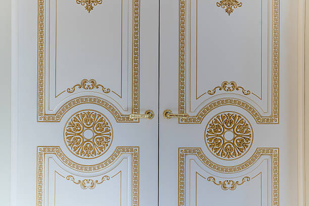 istock The gold and white door has a floral design on it 2236238581