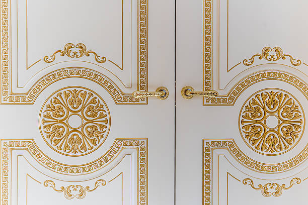 istock The gold and white door has a floral design on it 2236238835