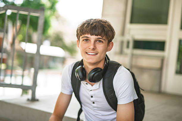 istock Portrait of smiling elementary school boy with his backpack 2236242403