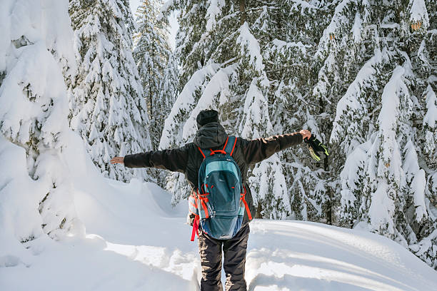 istock Senior man hiking in the winter mountain 2236243442