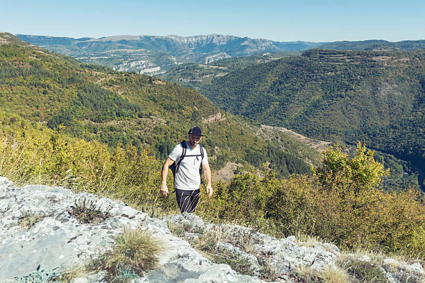 istock Young man hiking in the mountain 2236244908
