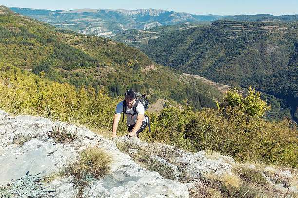 istock Young man hiking in the mountain 2236244934