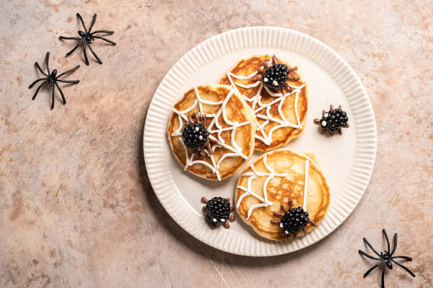 istock A plate of spider web pancakes with blackberries on top 2236245254