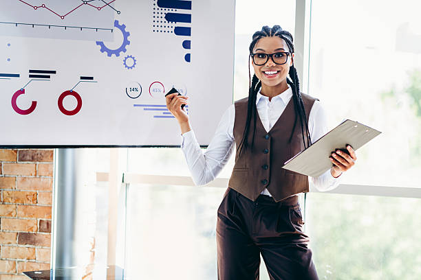 istock Confident businesswoman presenting analysis with charts in a professional office setting showcasing strategy and analytics 2236246066
