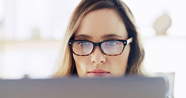 istock Creative, woman and reading on computer at house for research, editor feedback and proofreading. Journalist, glasses reflection and PC to review article, fact check and story report for publication 2236247349