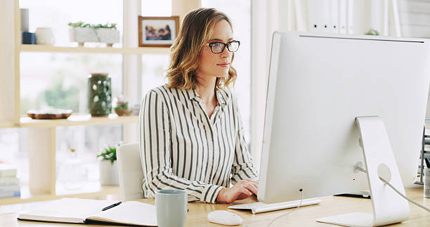 istock Business woman, office and computer for typing email with policy development, research or feedback. Desktop, reading and consultant in company to review project, compliance and check schedule online 2236247366