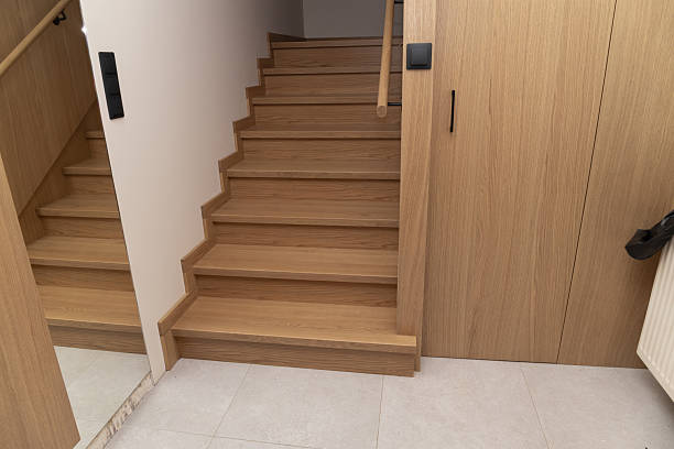 istock Wooden staircase in modern interior with wall light and mirror 2236253551