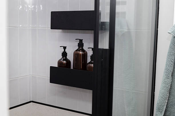 istock Brown bottles on shower shelf in modern bathroom interior 2236253603