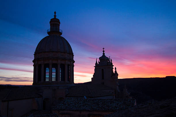 Ragusa Ibla, Sicily: The baroque 17th-century San Giorgio Cathedral with a pink dawn background. Ragusa Ibla is a UNESCO World Heritage Site.