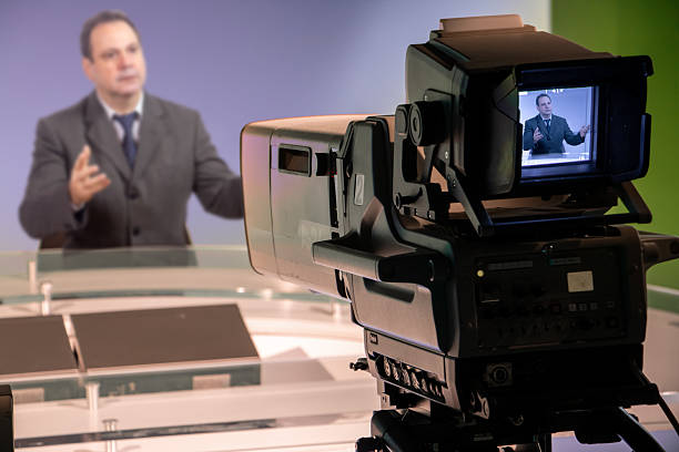 istock A man in a suit is talking in a television studio 2236256335