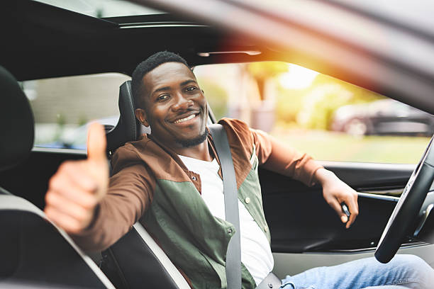 istock young black man with his new car 2236257560