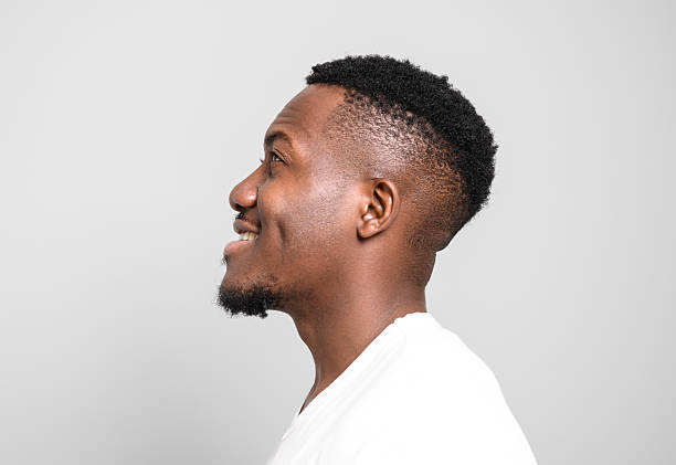 istock Black men wearing white shirt in studio shot on white background 2236258047