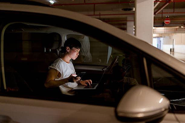 istock Japanese woman illuminated by screens while texting on smartphone 2236258211