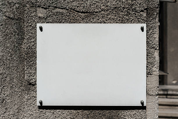 istock White plaque on stone wall, empty copy space, beautiful background for designer, mock-up 2236259602