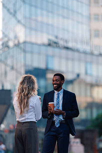 istock Business colleagues having coffee break outdoors 2236259711