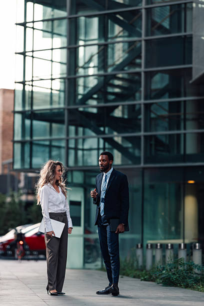 istock Business colleagues discussing work in urban city setting 2236260534