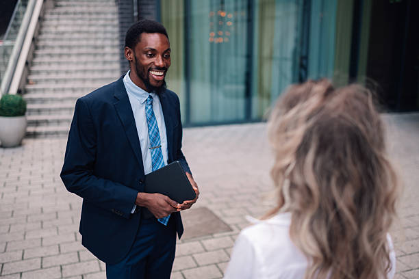 istock Businessman talking with colleague during outdoor meeting 2236260607