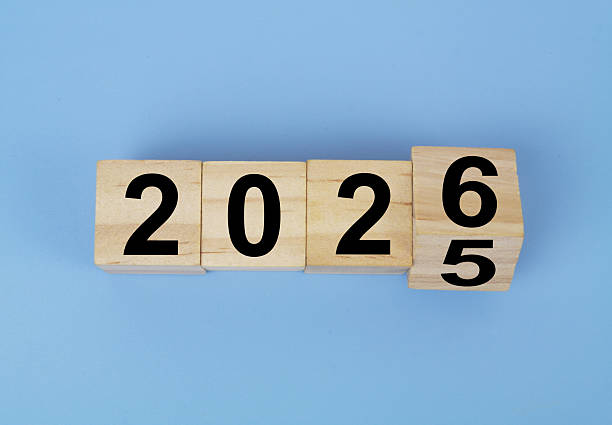 istock Cubes with numbers 2025 and 2026 on blue background. 2236262921