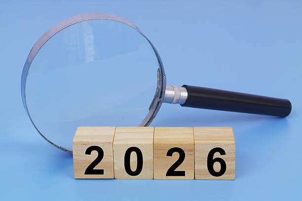 istock Magnifying glass and numbers 2026 on cubes. 2236262922