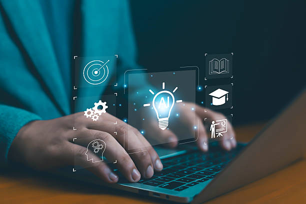 istock Close-up of hands typing on laptop with glowing AI icons, symbolizing artificial intelligence, innovation, machine learning, digital technology, and modern education concepts technology, academic 2236264577