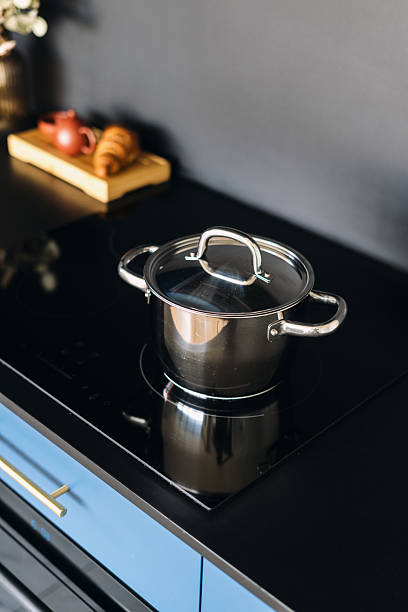 istock Modern blue kitchen cabinet showcasing elegant cooking pot on stovetop 2236266333