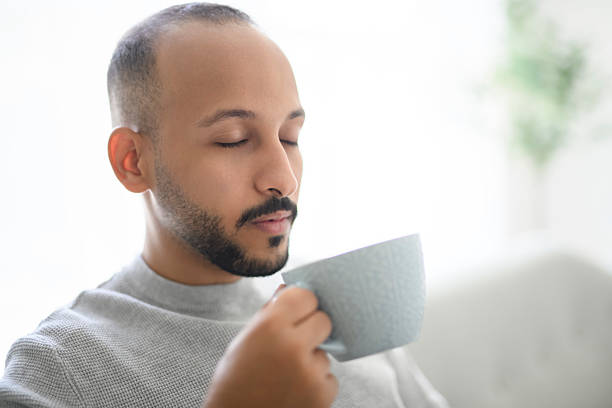 istock young islamic arab drink coffee on sofa at home 2236267083