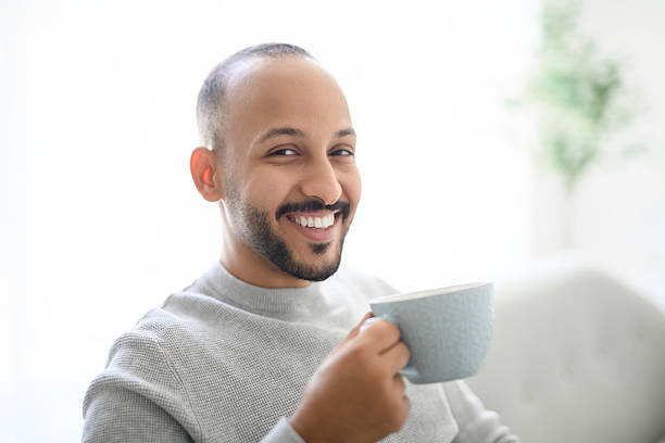 istock young islamic arab drink coffee on sofa at home 2236267086