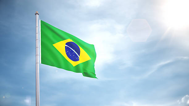 istock Brazil Flag Waving in the Wind in Blue Sky 2236271128