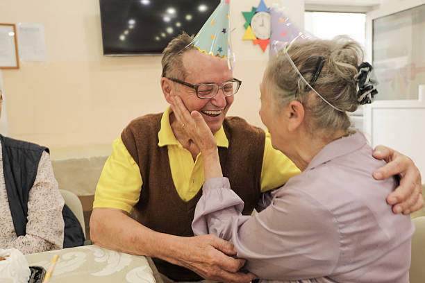 istock Senior Friends Enjoy Birthday Celebration With Cake 2236271340