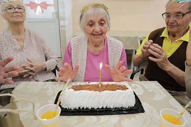 istock Elderly Group Having Fun At Birthday Party Gathering 2236272658