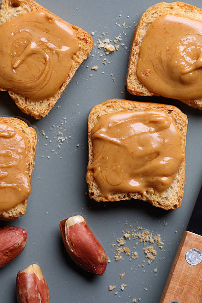 istock Peanut butter on crispy crackers an American Dream 2236274236