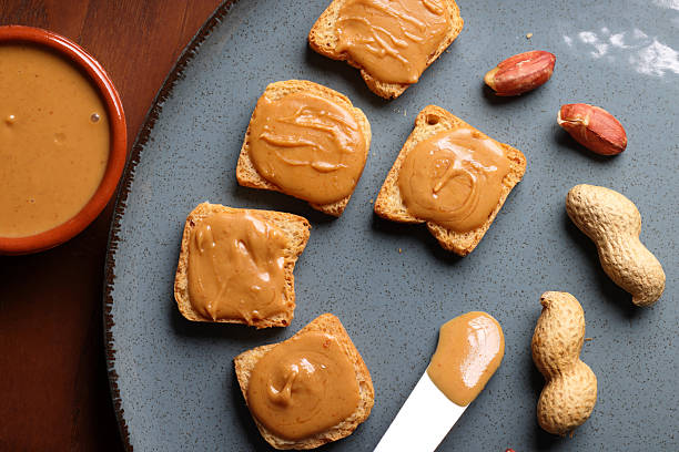 istock Peanut butter on crispy crackers an American Dream 2236274255