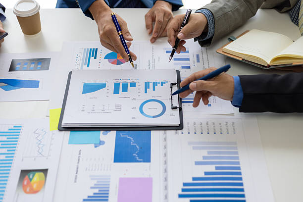 istock Business team analyzing chart and graph. Businesspeople corporate meeting, reviewing data financial report and marketing research. Discussing market situation analysis and financial planning. 2236274785