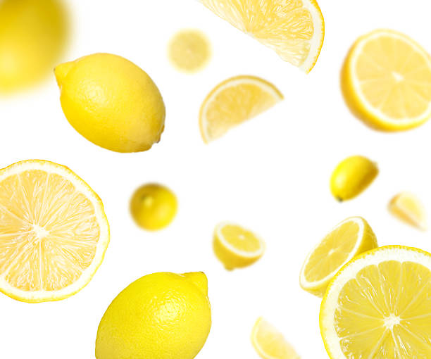 istock Fresh ripe lemons swirling in air against white background 2236275873