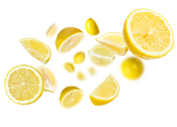 istock Fresh ripe lemons swirling in air against white background 2236275911