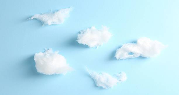 istock Clouds made of tasty white cotton candy on light blue background, flat lay 2236276361