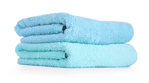 istock Stack of colorful terry towels isolated on white 2236277930