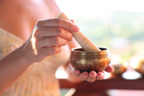 istock Woman with singing bowl outdoors, closeup view 2236278554
