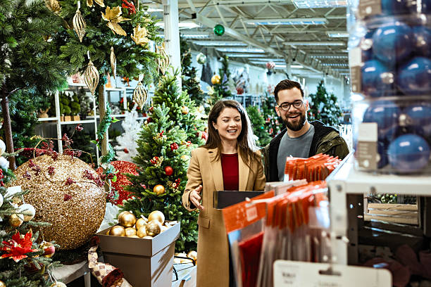 istock Young couple holding coffee while Christmas shopping 2236280501
