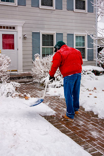 istock Senior Man Shoveling Snow 2236280894