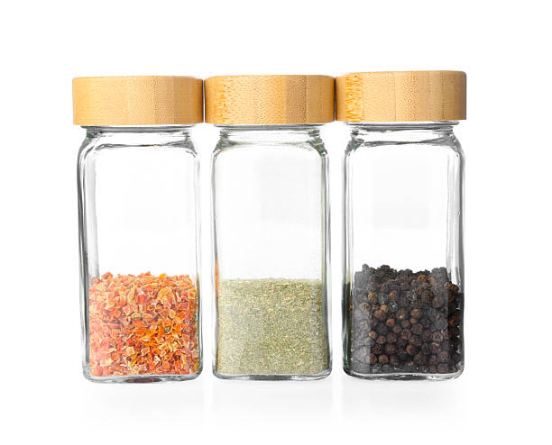 istock Aromatic spices in glass jars isolated on white 2236281089
