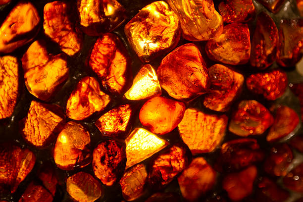 istock Vivid amber stones illuminated by light showcasing unique textures and colors 2236281289