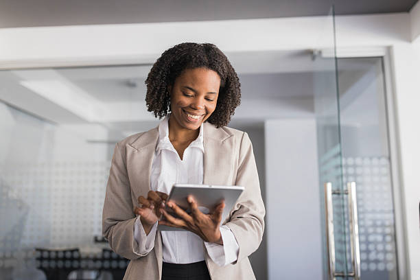 istock Happy black businesswoman using digital tablet in office 2236281508