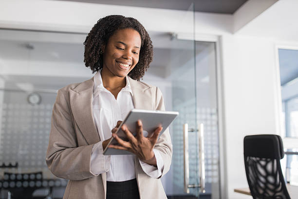 istock Smiling african american businesswoman using digital tablet in office 2236282456