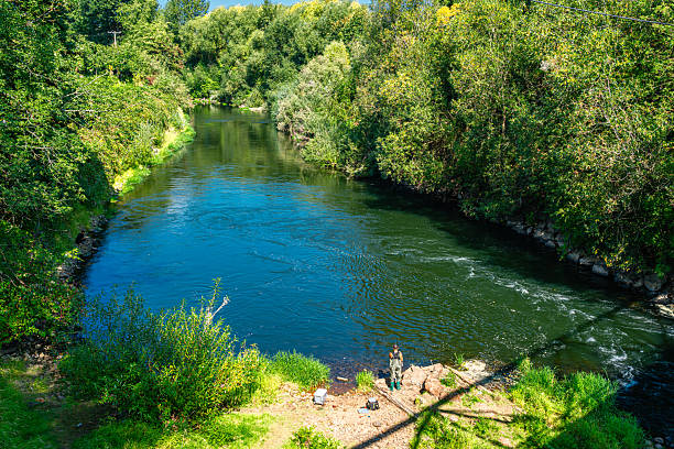 Fishing along the Green River in Kent, Washington.